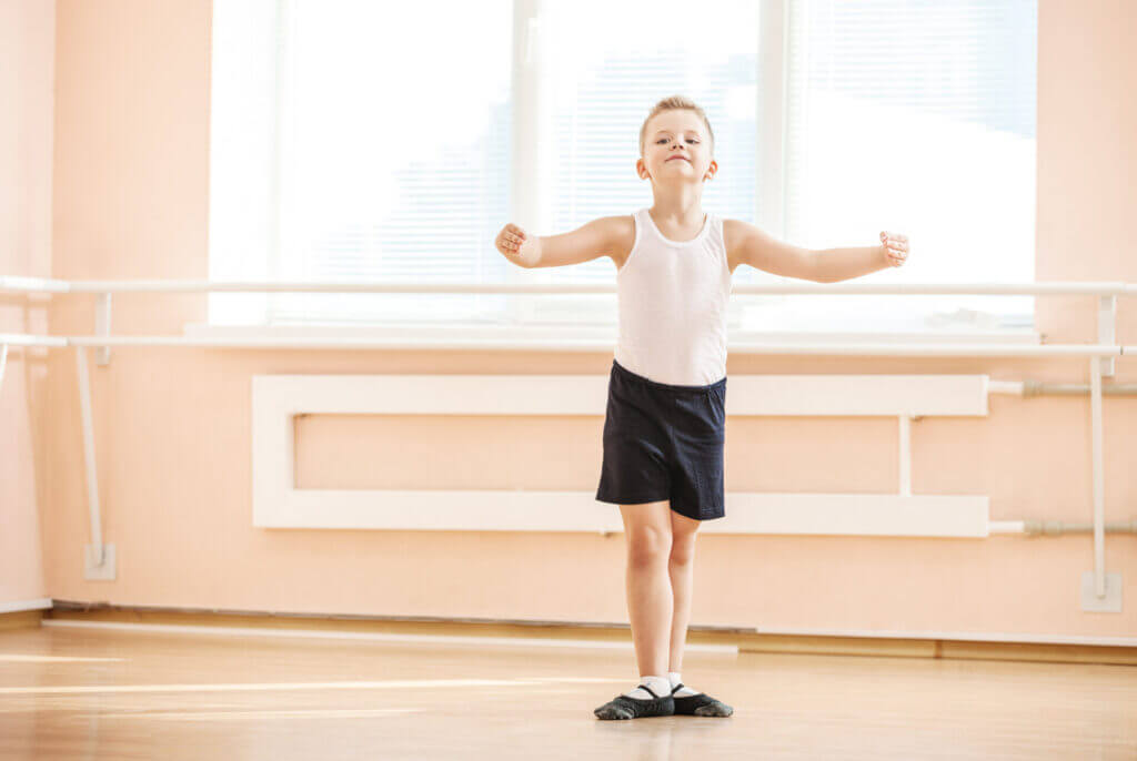 Little boy dancing at a ballet class